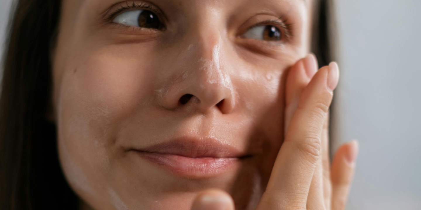 Woman applying hydrating moisturizer on dry skin to restore moisture and improve skin health