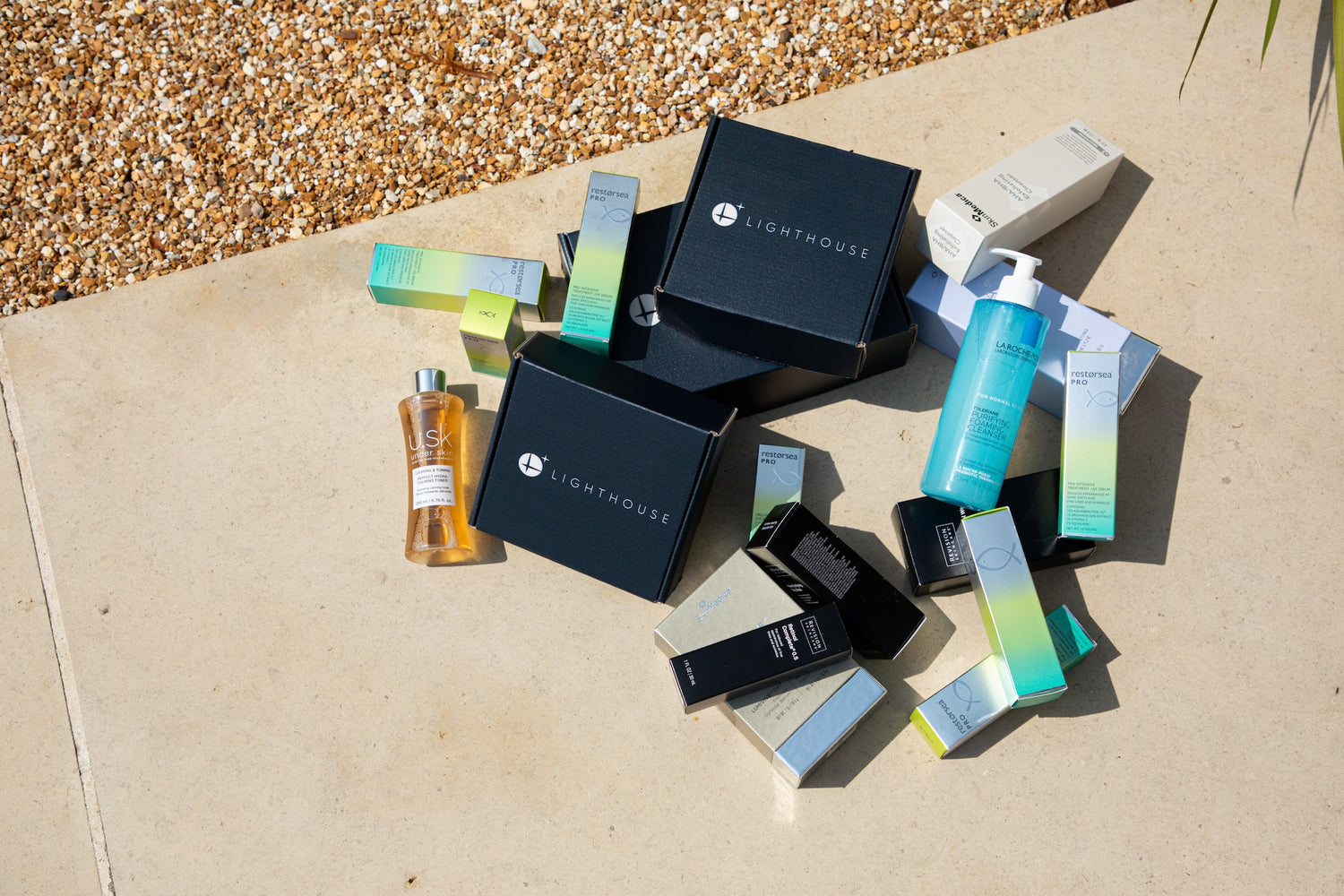 Flat lay of Lighthouse Skincare's range of products