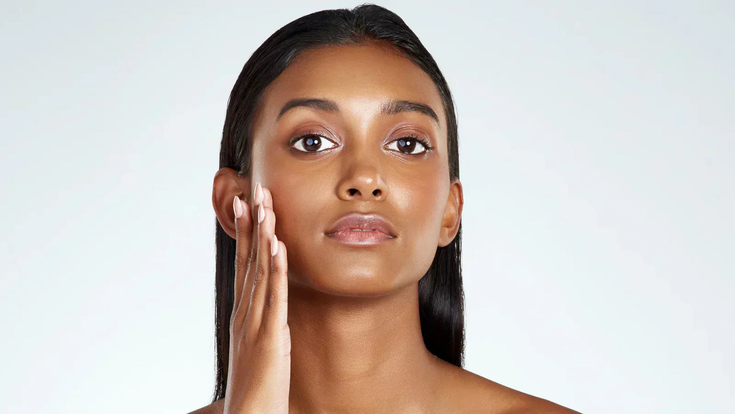 Woman with oily skin showing natural shine on face