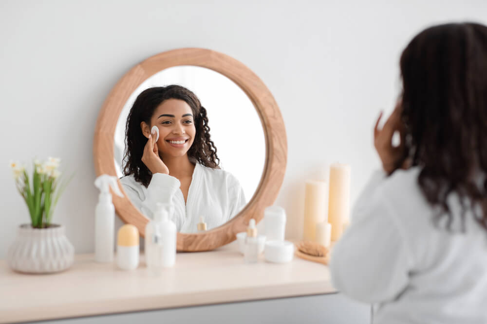 Woman applying skincare as part of her facial routine